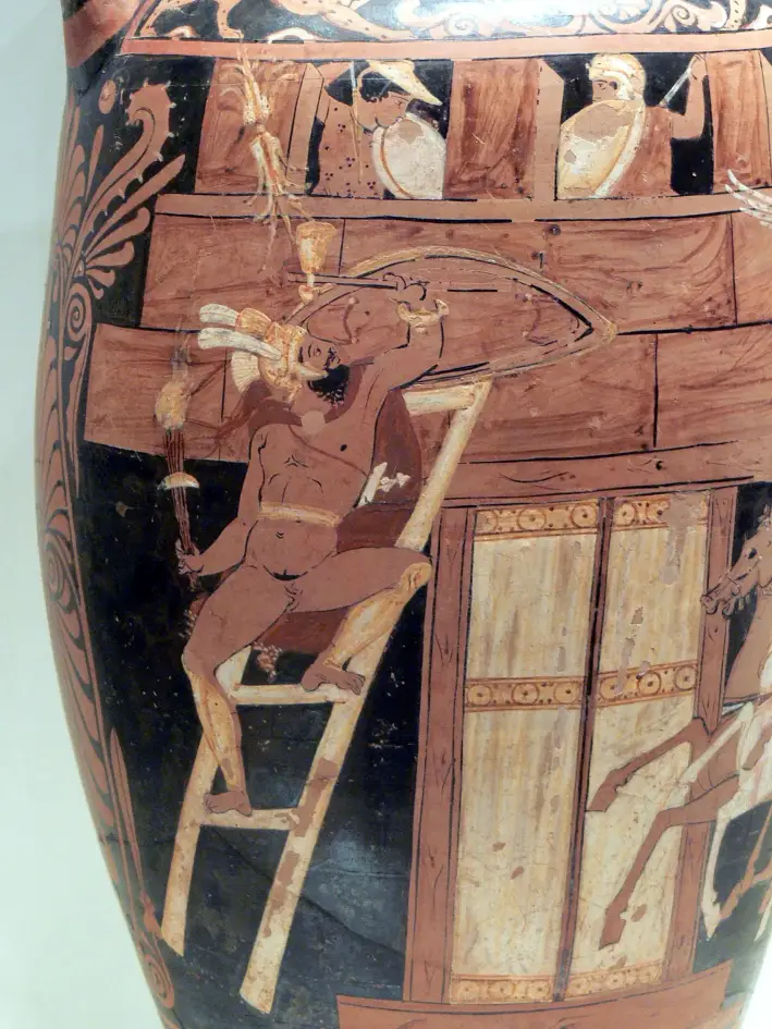 Escena de la obra «Los siete contra Tebas», de Esquilo: Capaneo escala las murallas de la ciudad para derrocar al rey Creonte, que mira hacia abajo desde las almenas. Figura roja de Campania en un ánfora de cuello, circa 340 a. C.; Museo J. Paul Getty. (Xenophon/CC BY-SA 3.0)