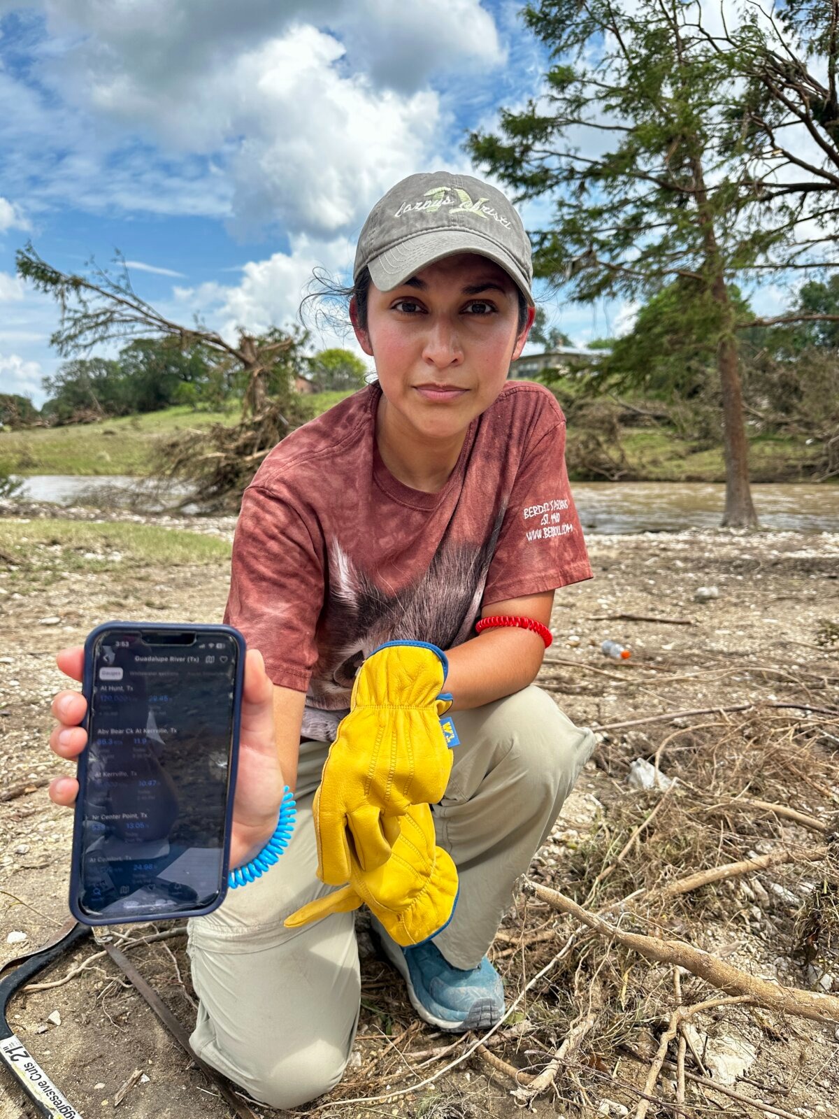 Lillian Sanchez, a Kerrville resident, has a phone app that tracks water flow in case of flooding. She volunteered to clean up debris at an RV resort in Center Point, Texas, on July 7, 2025. (Darlene McCormick Sanchez/The Epoch Times).